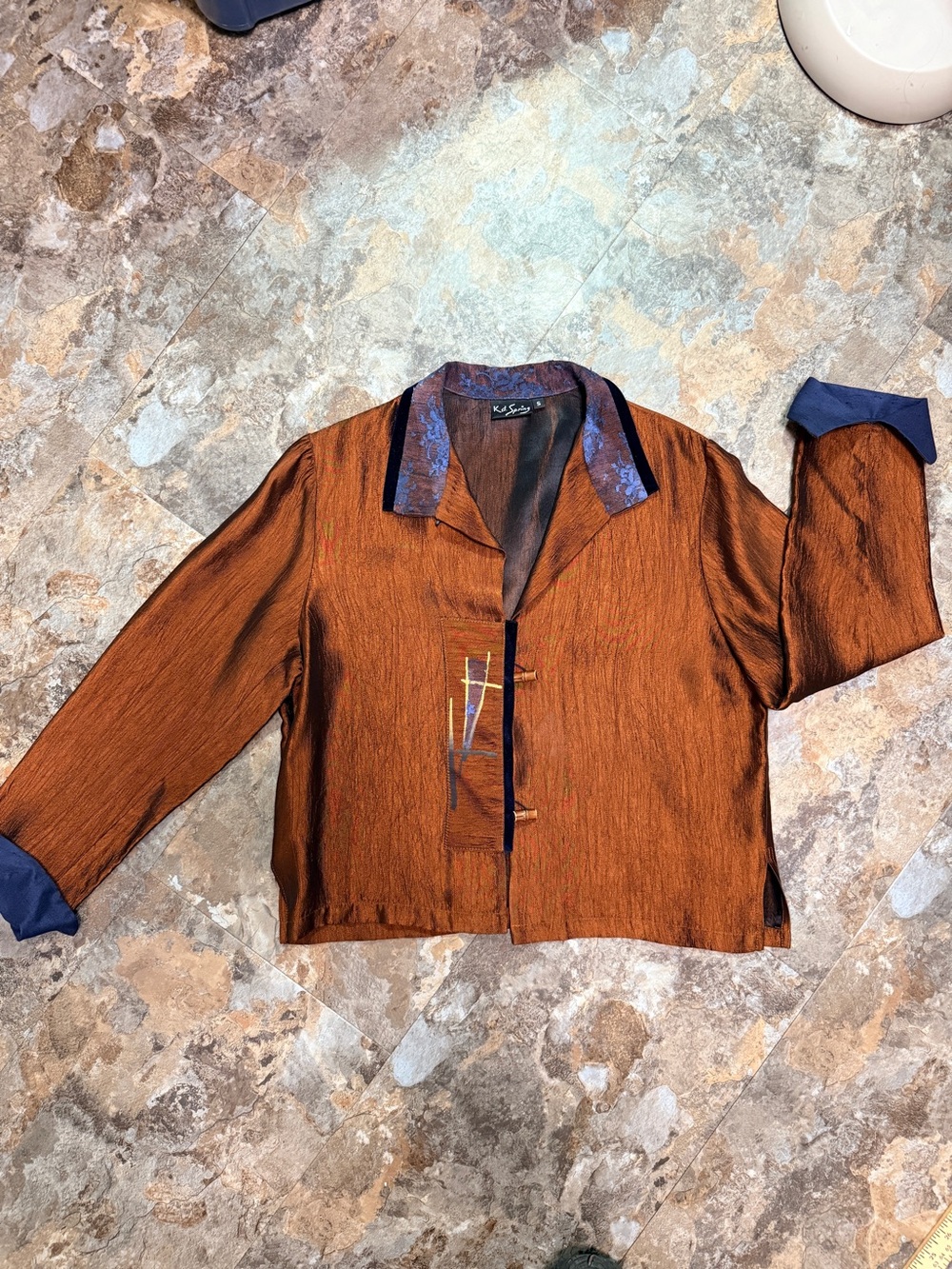 KD Spring metallic bronze jacket with blue lace on collar. Size S
